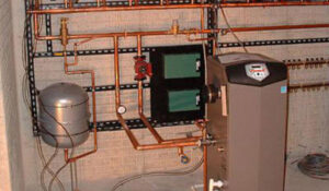 A complex boiler heating system with copper piping installed by Pugh Heating & Air Conditioning in Holland, OH.