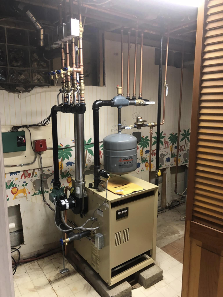 A newly installed boiler and heating system with copper piping by VHL Services LLC in Elizabeth, NJ.