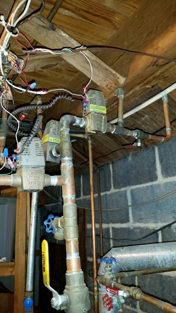 Copper pipes and valves for a boiler or heating system installation by American Team Inc in Warminster, PA