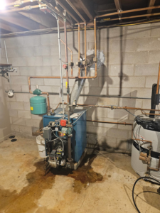 Older boiler heating system undergoing repair or maintenance by NewEra Mechanical LLC in New Britain, CT