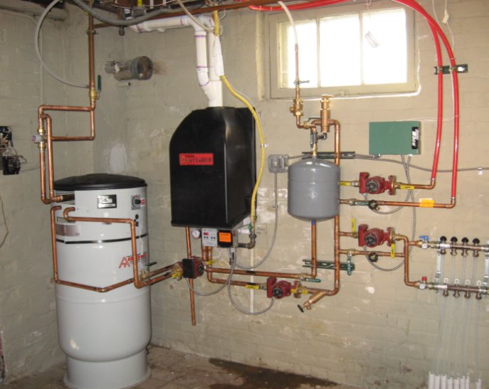 A complex boiler and hydronic heating system installation in a basement by 5 Star Charleston Heating and Air in Charleston, SC.