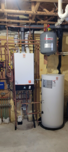 A newly installed boiler and water heater system with copper piping by Crome Mechanical Inc. in Cedar Springs, MI