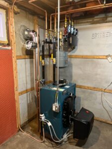 A newly installed boiler system with copper piping by Heritage Home Service in Worcester, MA