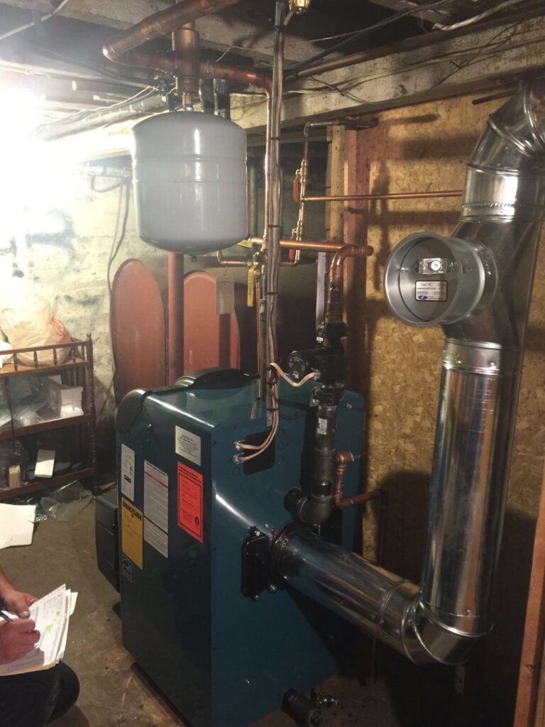 A new boiler installation with copper piping and an expansion tank by SFC Heating and A/C, LLC in Alexandria, VA.