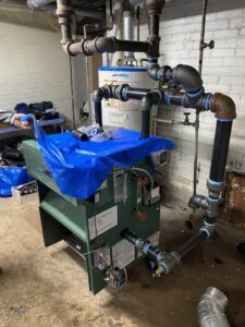 A new boiler installation with extensive piping by FLAME Heating, Cooling, Plumbing & Electrical in Warren, MI.