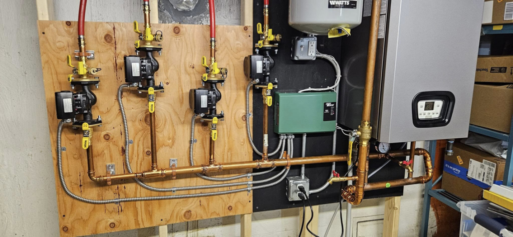 A complete boiler and pump system with electrical connections installed by Steven Polom, Journeyman Electrician in Springfield, MA.