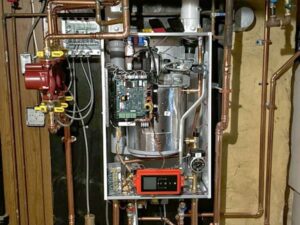 Internal components of a boiler or heating system serviced by QC Mechanical, Inc. in Lockport, NY.