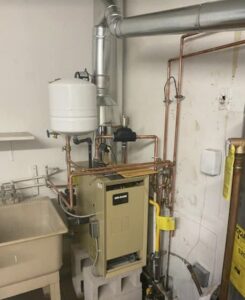 A new boiler system with copper piping and an expansion tank installed by Air We Are in Toms River, NJ.