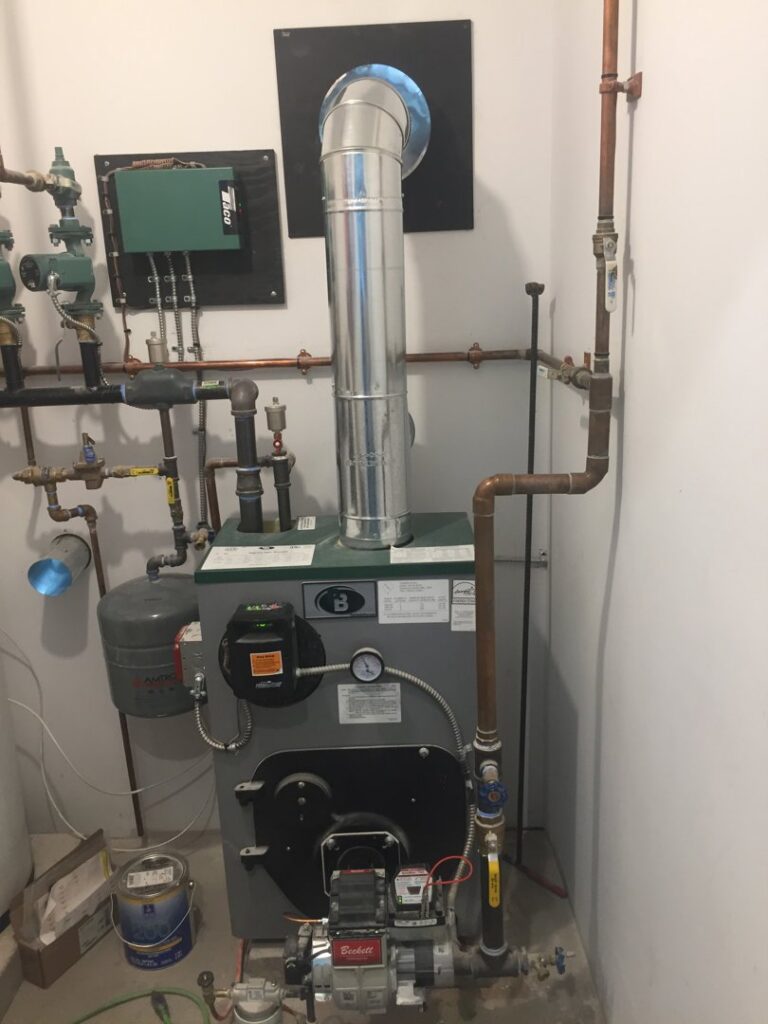 A detailed view of a boiler system installation with copper piping by JLP Heating & Cooling in Norwalk, CT