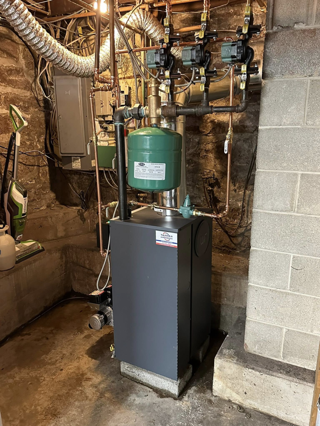 A new boiler system with copper piping and an expansion tank installed by Tapper Energy in Dauphin, PA.