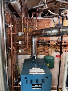 A boiler heating system with extensive copper piping installed by True Heating and Cooling in Greenfield, IN.