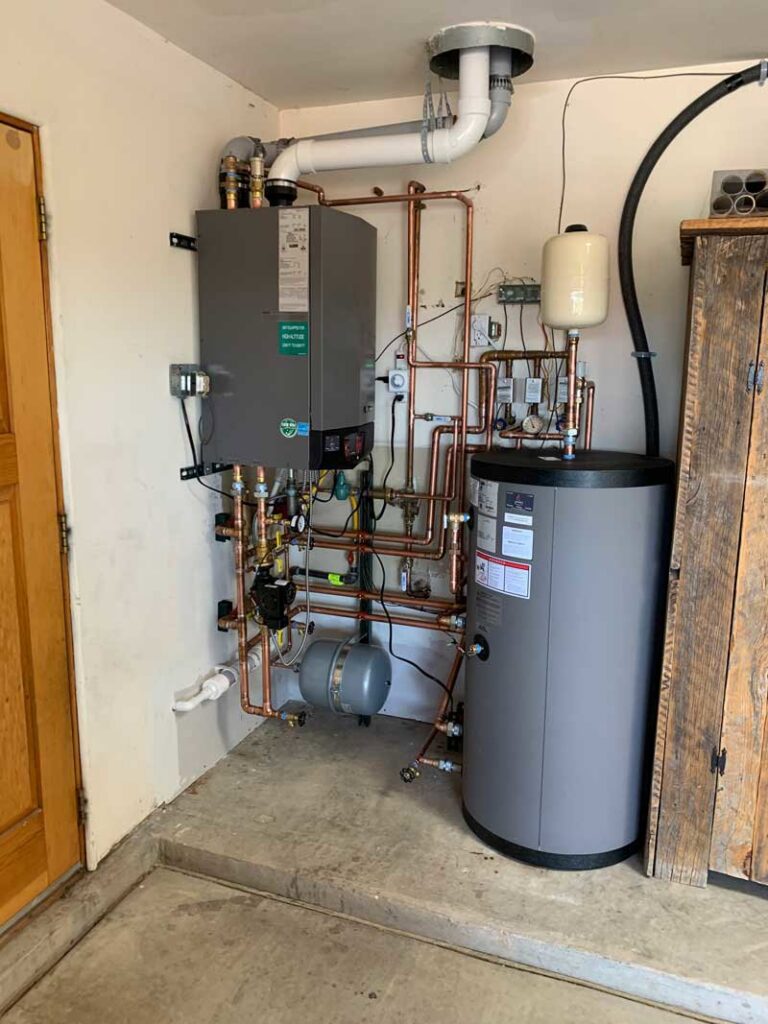 A newly installed boiler and water heater system with copper piping by Jerome's Mechanical, LLC in Santa Fe, NM