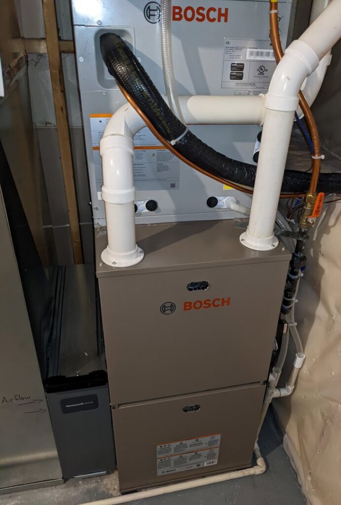A Bosch furnace and air handler unit with ductwork installed by Advanced Heating & Cooling in St. Cloud, MN.