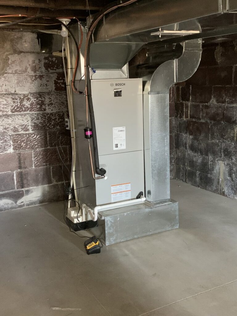 A new Bosch furnace and ductwork installation in a basement by Pacifico Heating and Cooling in Shadyside, OH.