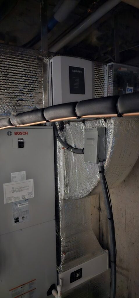 A Bosch HVAC air handler and Aprilaire air purifier installed with ductwork by Ultra Installs in Barrington, NH