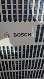 A close-up of a Bosch HVAC unit grille, indicating quality installations by Conrad Heating and Cooling in Beaverton, OR.