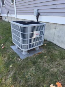 A Bosch outdoor air conditioning unit installed on a raised stand by Revolution HVAC in Owings Mills, MD.