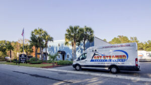 A Get Steamed Carpet Cleaning, Inc. branded van parked outside a commercial building in North Charleston, SC.