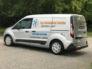 A branded HVAC service van from Top Mechanical Service, parked and ready for calls in East Longmeadow, MA.