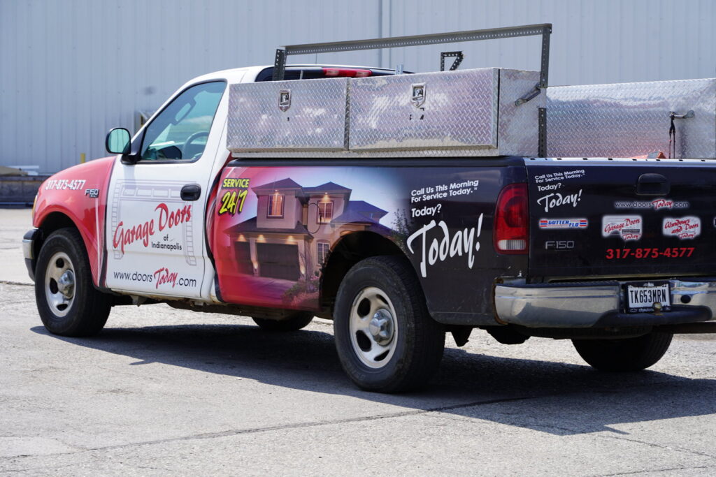 A branded service truck for Garage Doors Of Indianapolis, ready for jobs in Indianapolis, IN