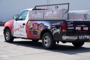 A branded service truck for Garage Doors Of Indianapolis, ready for jobs in Indianapolis, IN