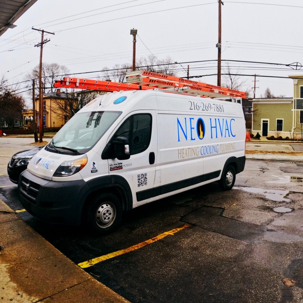 A branded service van for North East Ohio Master Plumbing, Heating, and Cooling Contractors parked in Cleveland, OH.