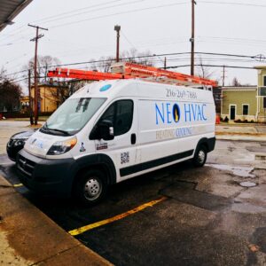 A branded service van for North East Ohio Master Plumbing, Heating, and Cooling Contractors parked in Cleveland, OH.
