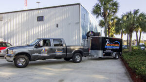 A Get Steamed Carpet Cleaning, Inc. branded truck pulling a service trailer in North Charleston, SC.
