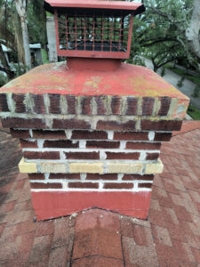 A brick chimney showing recent repair and restoration work by A Sweep Across the Bay in Parrish, FL.