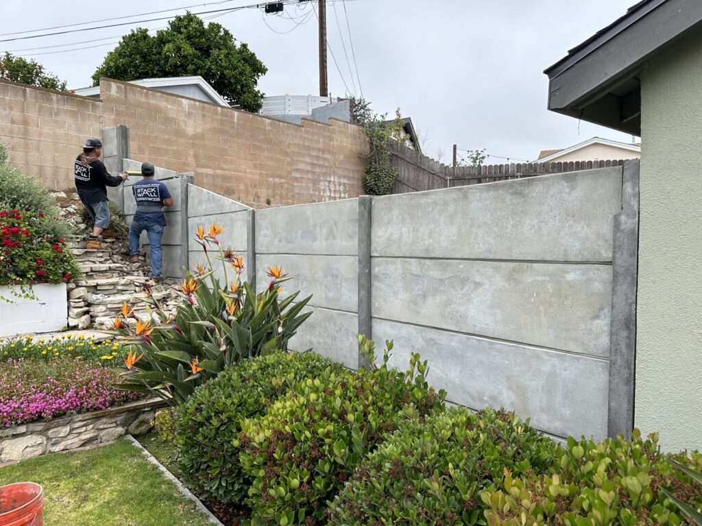 A close-up of a concrete fence featuring a detailed brick-like texture by StackWall Manufacturing in Pomona, CA.