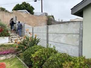 A close-up of a concrete fence featuring a detailed brick-like texture by StackWall Manufacturing in Pomona, CA.