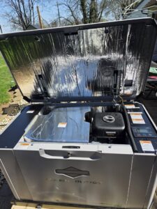 An open Briggs & Stratton standby generator, showing internal components during maintenance or installation by York Electrical Services in York, PA.