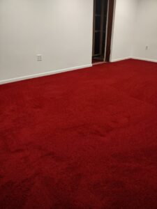 A room featuring a vibrant bright red carpet installation by New City Carpet And Flooring in Chicago, IL
