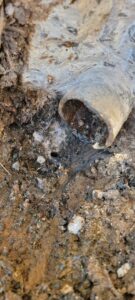 A broken underground pipe being repaired by Call The Doc Air Doctor Heating, Air Conditioning and Plumbing in Richardson, TX.
