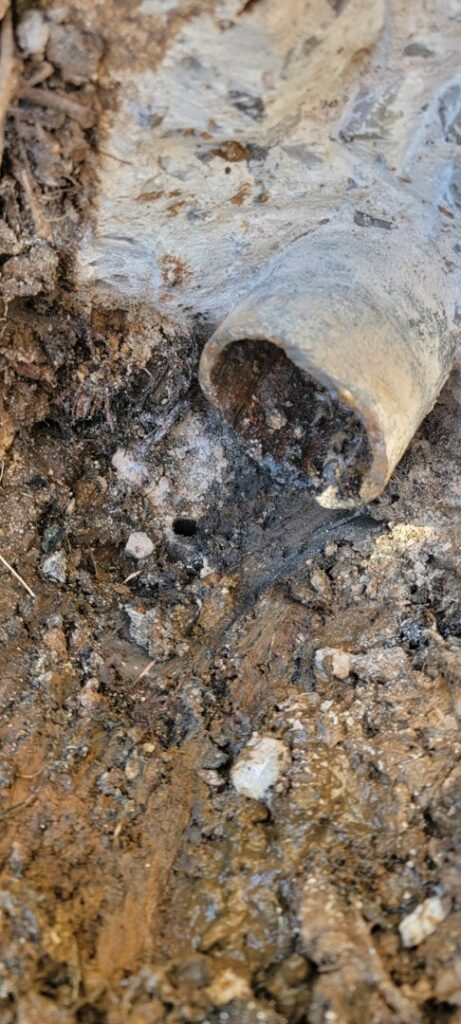 A broken underground pipe being repaired by Call The Doc Air Doctor Heating, Air Conditioning and Plumbing in Richardson, TX.