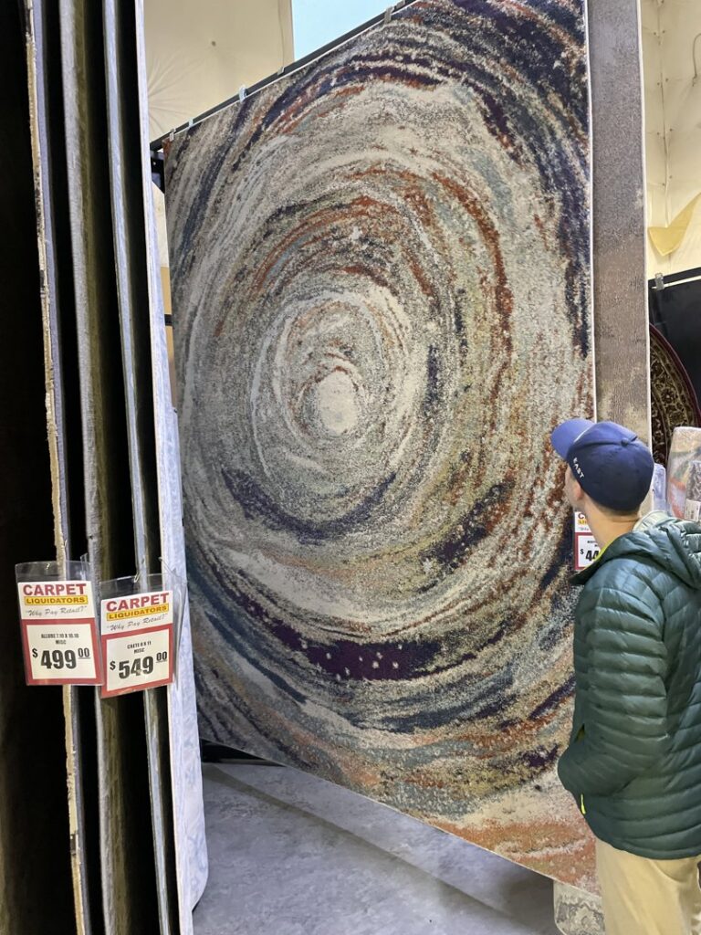 A completed brown carpet installation on a staircase by Carpet Liquidators in Linthicum Heights, MD.