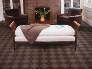 A room with a stylish brown checkered carpet installed by Floor Designs Unlimited, LLC in Pittsburgh, PA