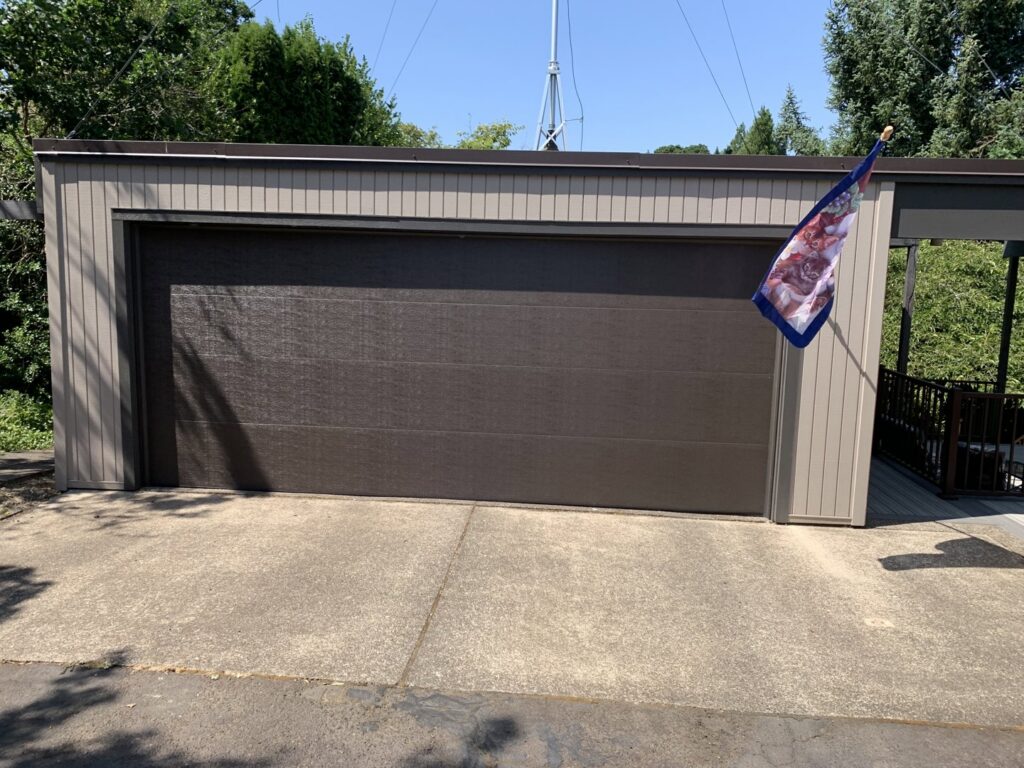 A brown garage door installation completed by Revolution Garage Door, LLC in Corvallis, OR.