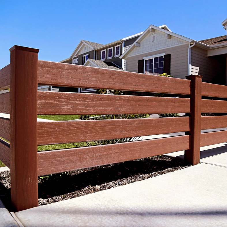A stylish brown horizontal slat fence installed in a residential area by Performance Fencing in Rigby, ID.