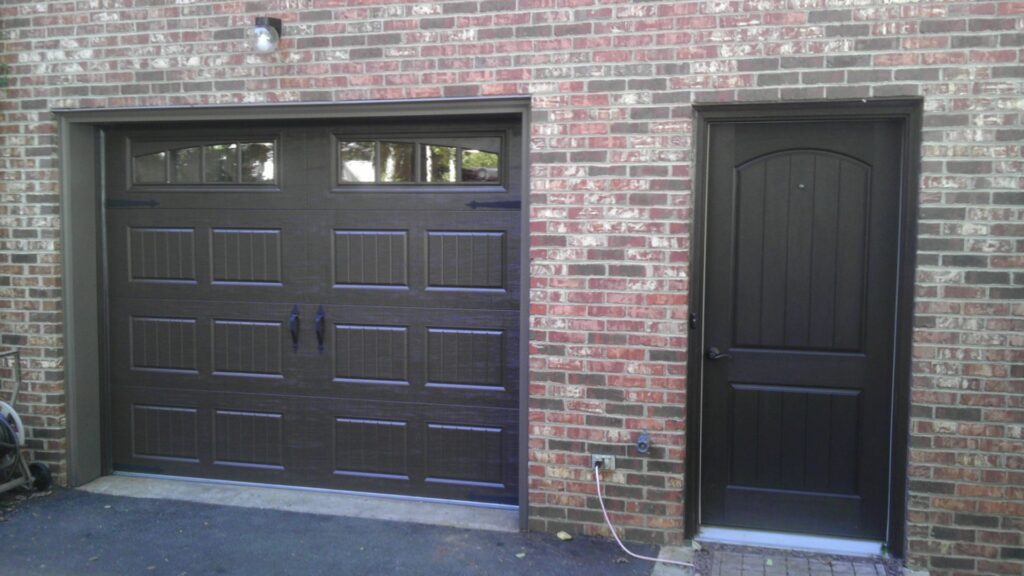 A newly installed brown residential garage door by Universal Overhead And Garage Doors in Baltimore, MD.
