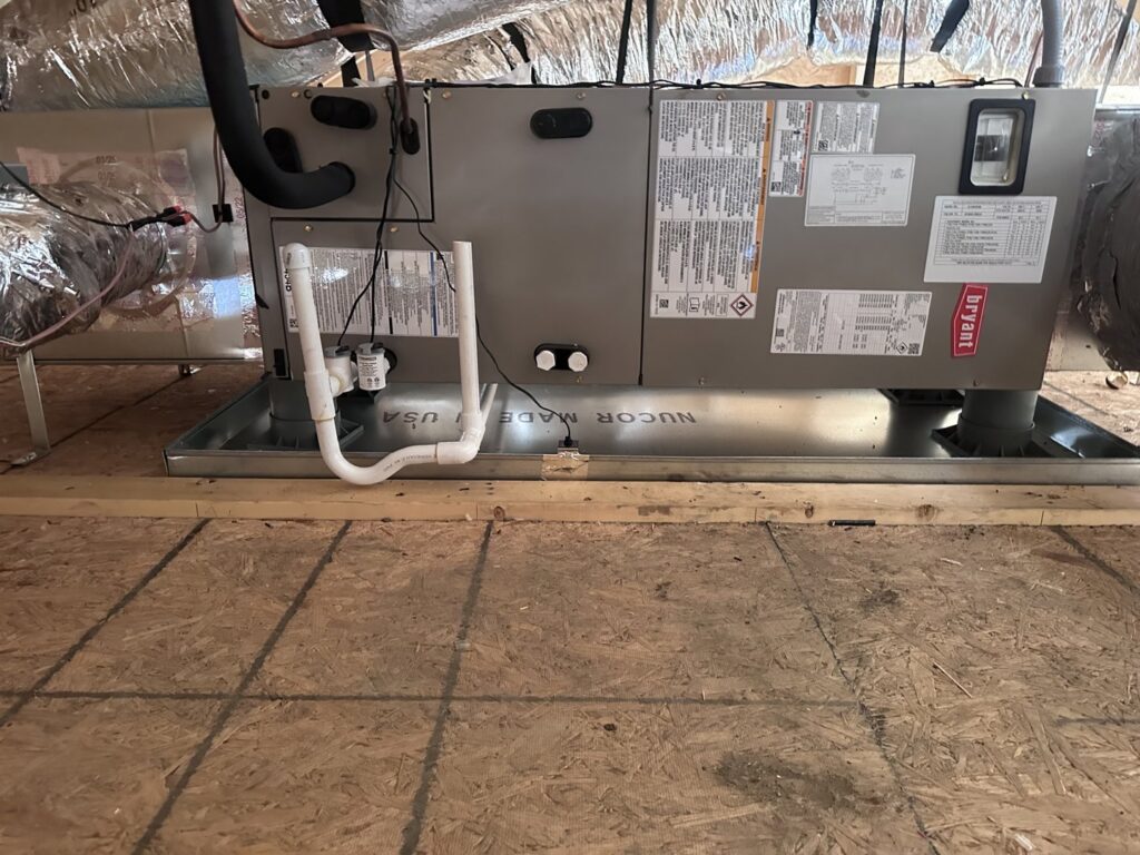 A Bryant air handler unit installed in an attic space by Comfort Temp HVAC LLC in Fort Smith, AR