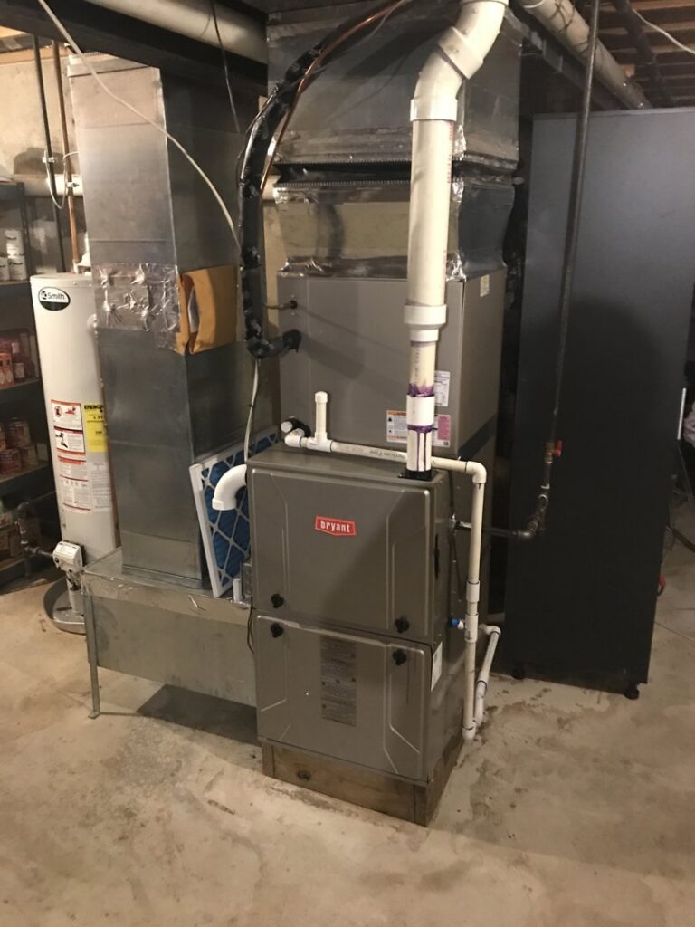 A Bryant furnace and air handler unit installed in a basement with ductwork by JDL HVAC Services, LLC in Laurel, MD.