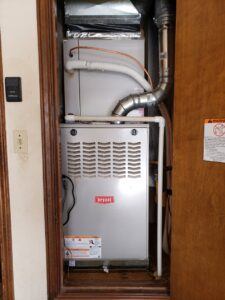 An indoor Bryant furnace and air handler unit installed by Reading Plumbing, Heating & Air Conditioning in Roswell, NM