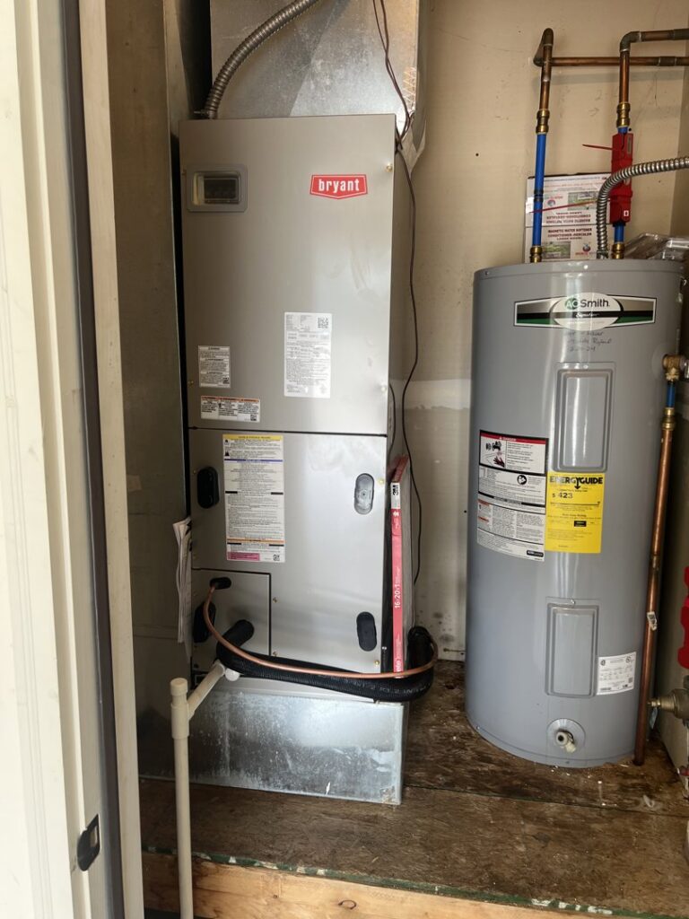 A Bryant furnace unit and water heater installed in a utility closet by 4-BIS Solutions HVAC and Home Maintenance in Columbia, MO.