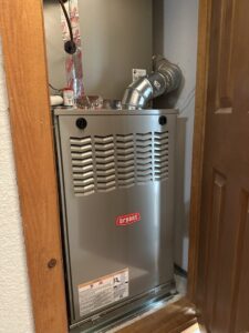A newly installed Bryant furnace and air handler unit in a closet by Aircon Heating and Cooling Inc in Las Cruces, NM