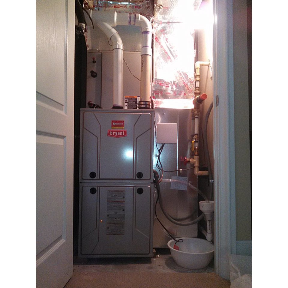 A Bryant HVAC furnace unit installed in a utility closet by Dan Deckard Hvac in Charlotte, NC