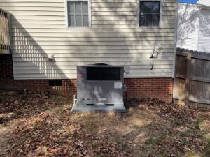 A Bryant outdoor HVAC unit newly installed next to a residential home by Luciano's Air Services in Durham, NC.