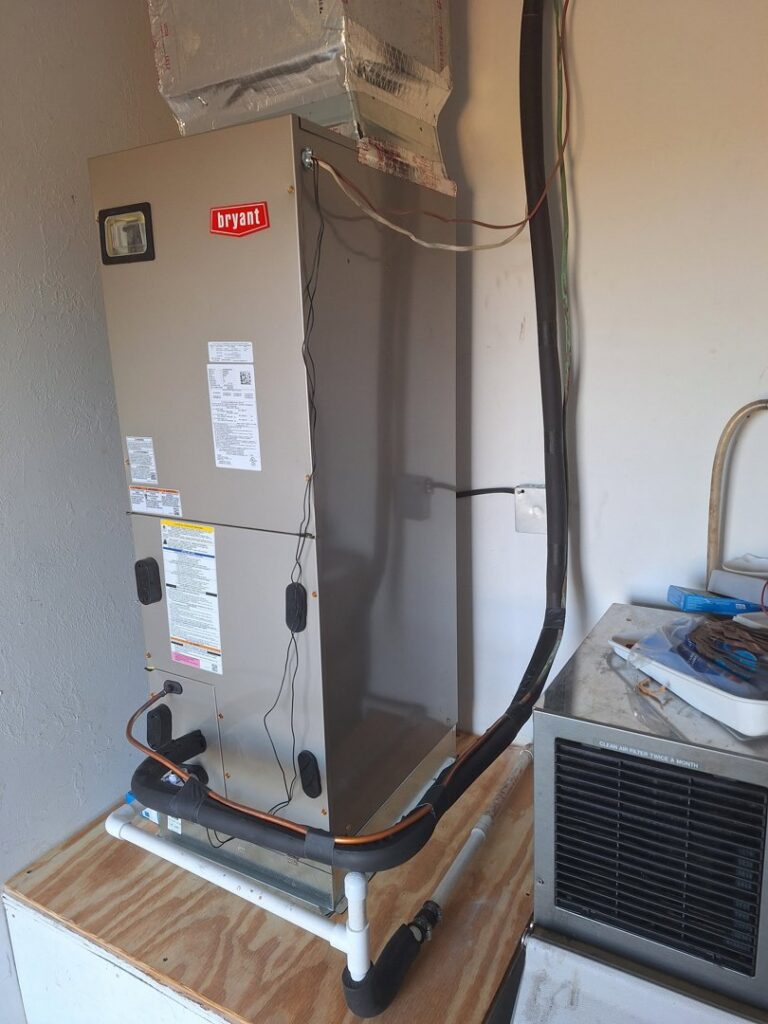An indoor Bryant air handler or furnace unit installed by The Right Flow Heating and Air LLC in Lawton, OK