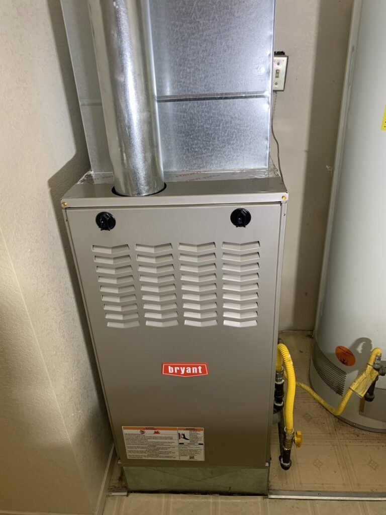 An installed Bryant indoor furnace unit with ductwork and gas lines by Hawkins Heating & Air in Carson City, NV