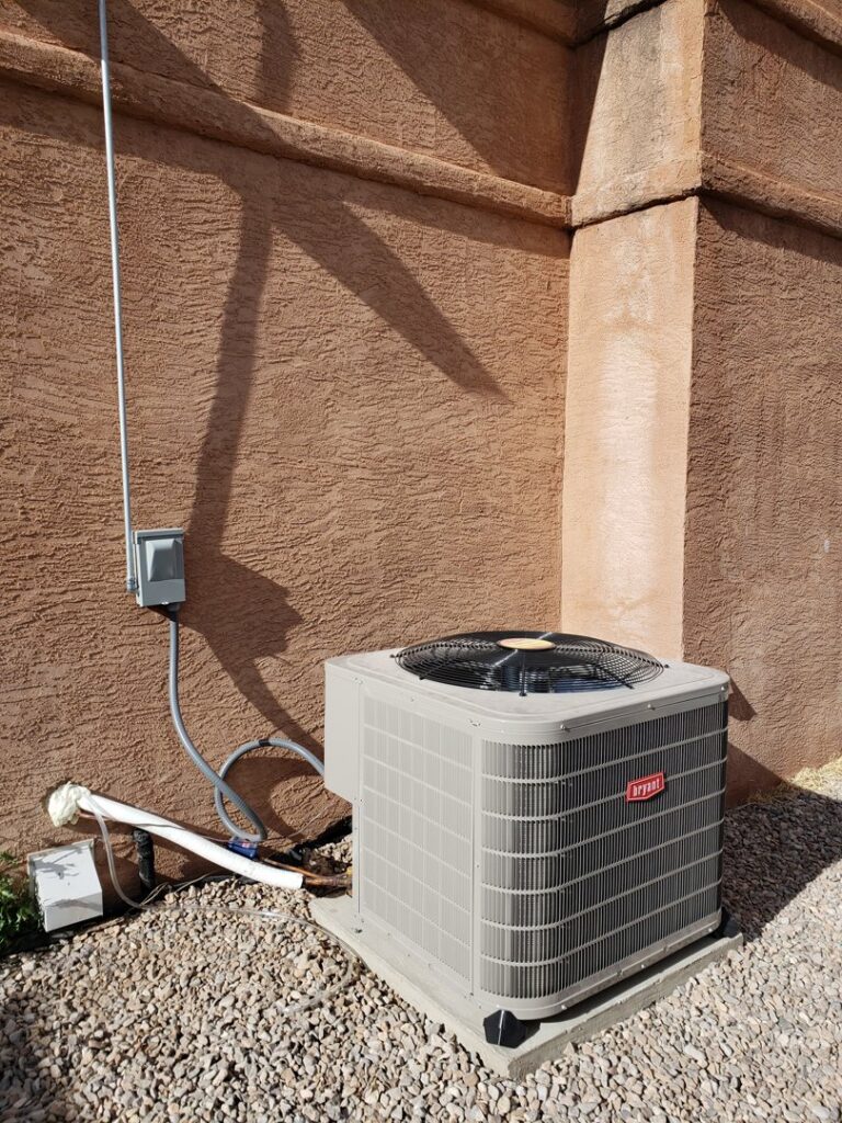 An outdoor Bryant air conditioning condenser unit installed by Reading Plumbing, Heating & Air Conditioning in Roswell, NM